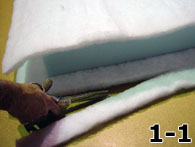 Person Using Scissors to Cut Dacron to Size
