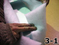 Person Folding Dacron Over Side of Foam