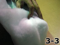 Person Folding Dacron Over Side of Foam