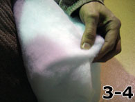 Person Folding Dacron Over Side of Foam