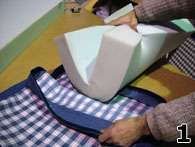 Hands Folding Foam to Put Into Cover