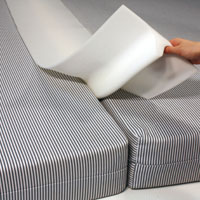 a Foam Bed Bridge, produced by the CNC Horizontal Cutter Machine, is in the middle of two striped foam beds