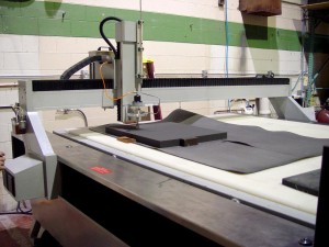 Charcoal foam being cut on the waterjet