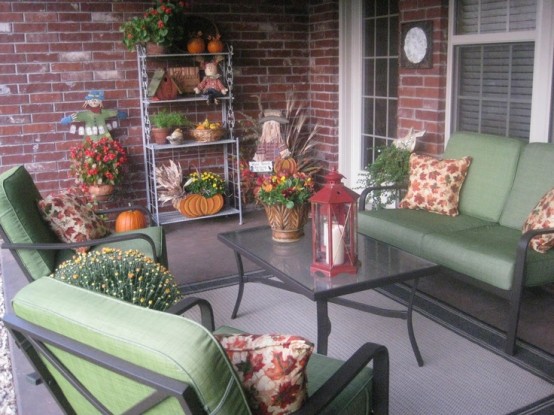 Outside patio setting with green furniture.